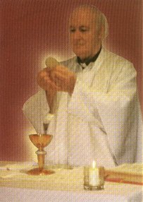 Fr. Edward Carter, S.J. with the Eucharist