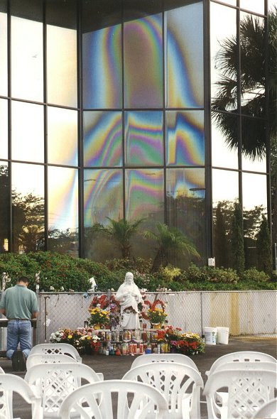 Blessed Virgin Mary on building with Sacred Heart Jesus under it.